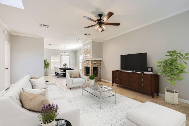 living room featuring visible vents, baseboards, and a stone fireplace