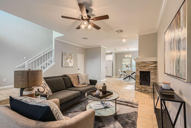 1703 Pecos Valley Cv, Round Rock, TX 78665 - living area with ceiling fan, stairs, baseboards, ornamental molding, and a chandelier