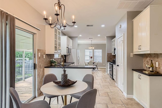 1703 Pecos Valley Cv, Round Rock, TX 78665 - dining space with a chandelier, baseboards, stone tile flooring, and recessed lighting