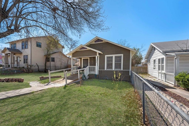 view of front of property with a front yard and fence private yard