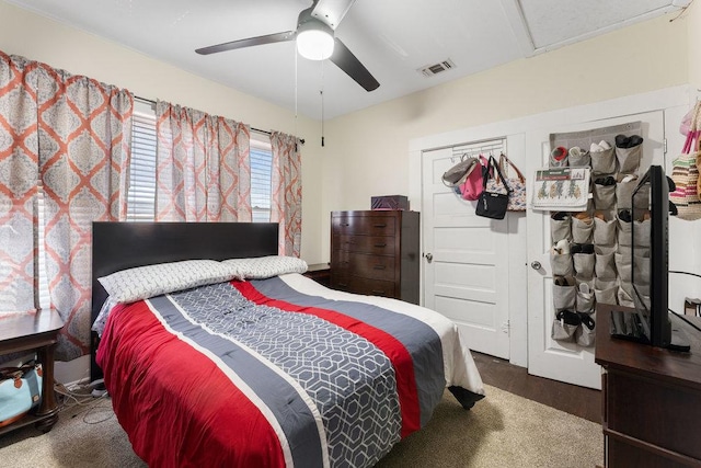 bedroom with visible vents and a ceiling fan