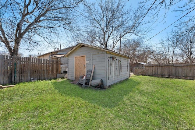 view of shed featuring a fenced backyard