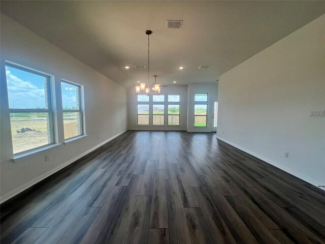 20425 Gillbrand Rd, Manor, TX 78653 - unfurnished dining area featuring a chandelier, dark wood-style flooring, and recessed lighting