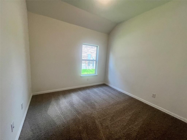 20425 Gillbrand Rd, Manor, TX 78653 - empty room with dark colored carpet and lofted ceiling