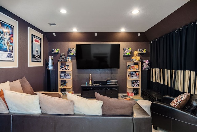 living area featuring recessed lighting and visible vents