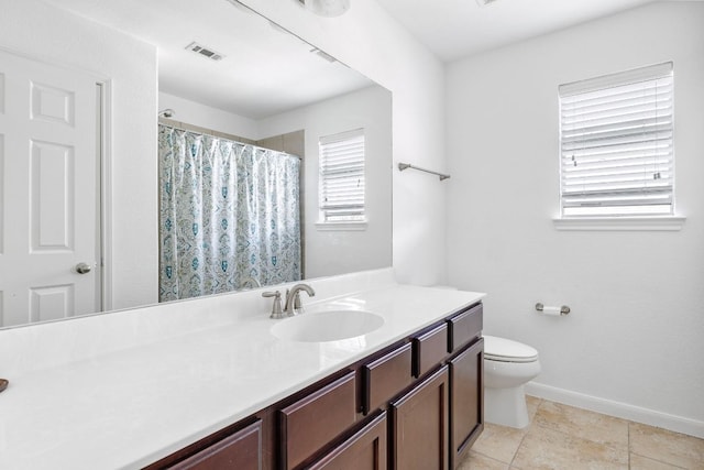 bathroom featuring visible vents, baseboards, toilet, a shower with curtain, and vanity