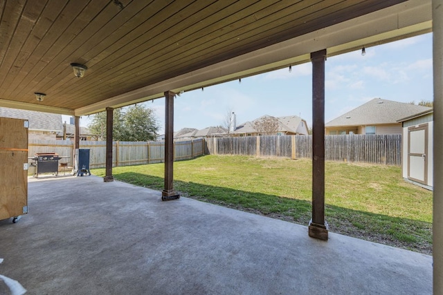2246 Garlic Creek Dr, Buda, TX 78610 - fenced backyard with a patio and a storage unit