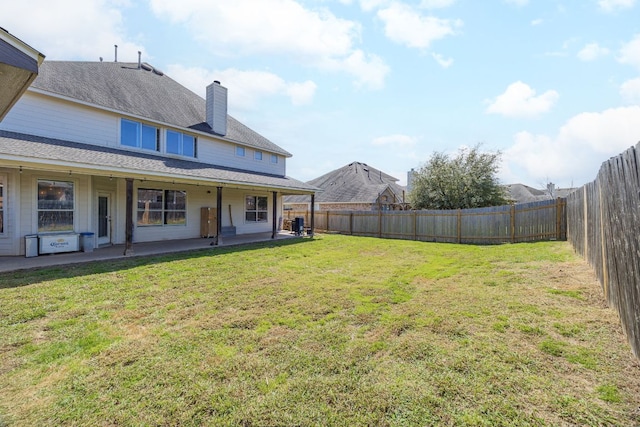 view of yard with a patio area and a fenced backyard