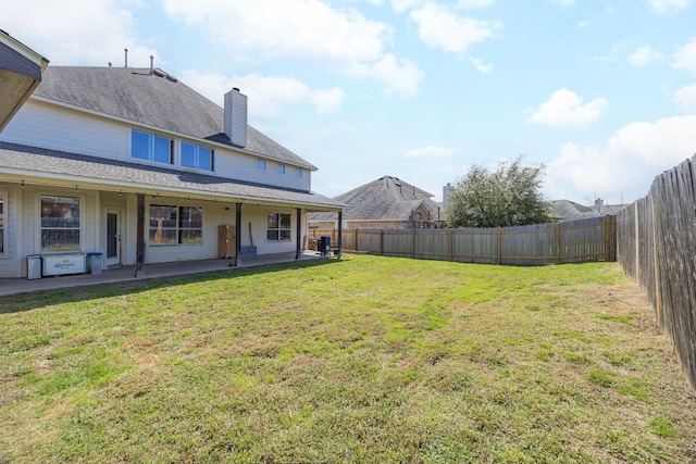 2246 Garlic Creek Dr, Buda, TX 78610 - fenced backyard featuring a patio area