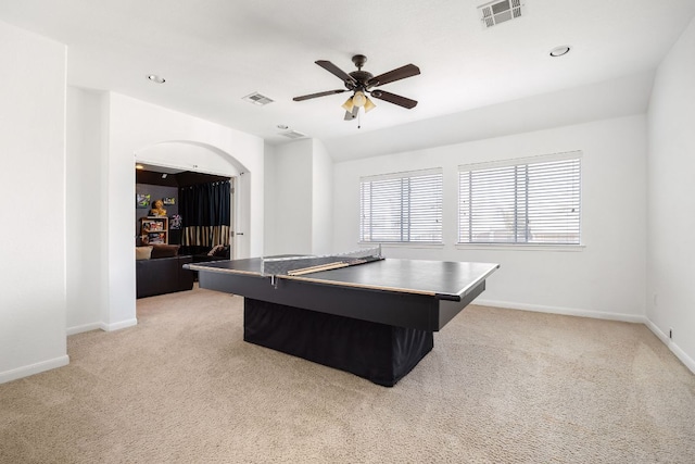 game room featuring visible vents, light colored carpet, a ceiling fan, and baseboards