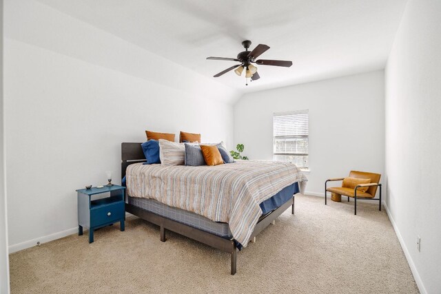 bedroom featuring light colored carpet and baseboards