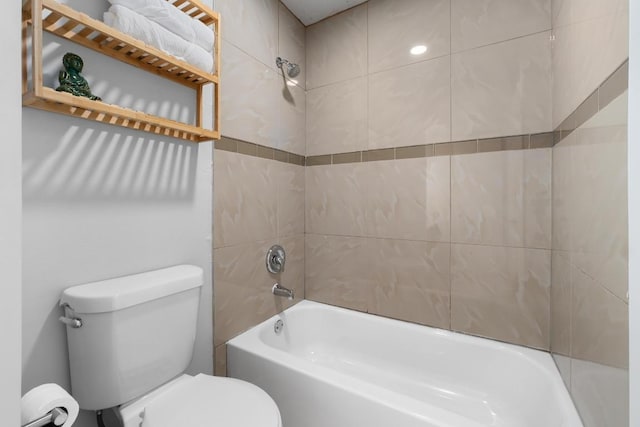 bathroom featuring toilet and shower / bathtub combination