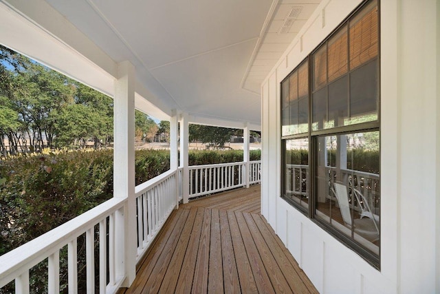 wooden deck featuring covered porch