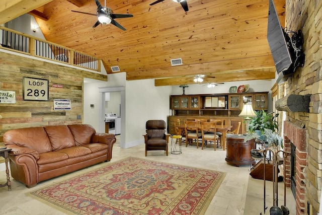 living room with a brick fireplace, high vaulted ceiling, wooden ceiling, and ceiling fan