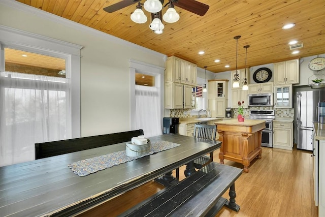 dining room with visible vents, recessed lighting, crown molding, light wood-style floors, and wooden ceiling