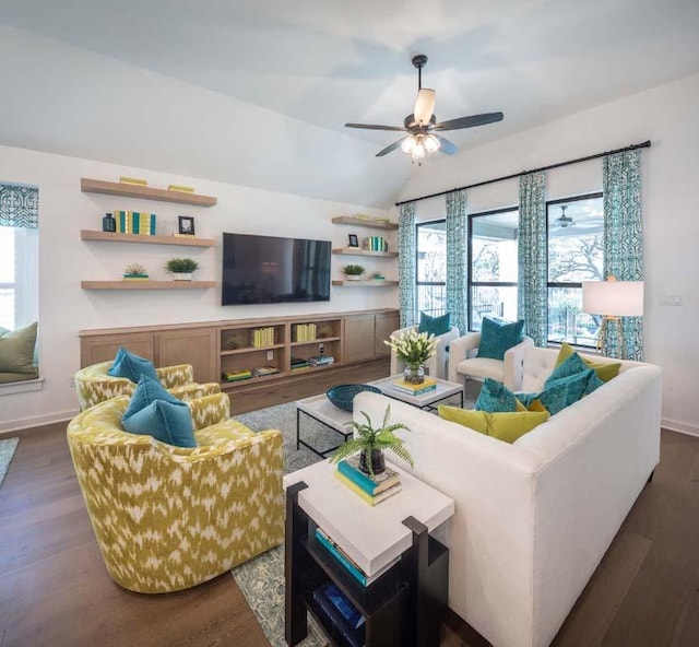 living area with vaulted ceiling, baseboards, dark wood-style flooring, and ceiling fan