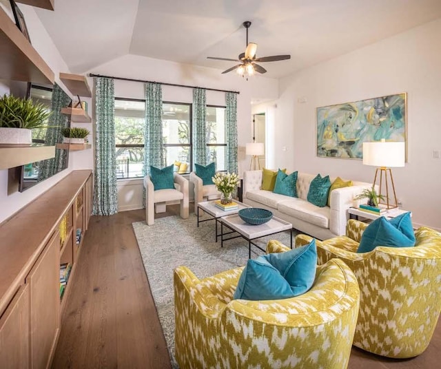 living room with lofted ceiling, ceiling fan, and hardwood / wood-style floors