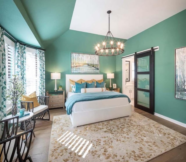 bedroom featuring a notable chandelier, wood finished floors, baseboards, and vaulted ceiling