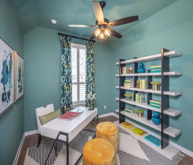 office featuring baseboards, lofted ceiling, and wood finished floors