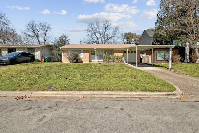 view of front facade featuring brick siding, a carport, concrete driveway, and a front lawn