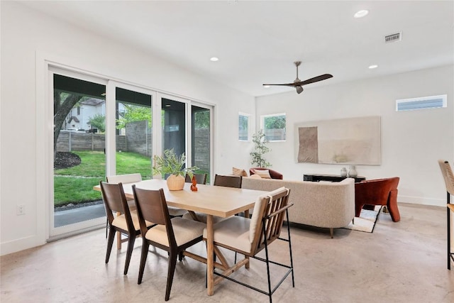 dining space with visible vents, baseboards, finished concrete floors, recessed lighting, and a ceiling fan