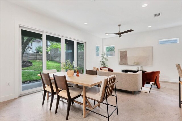 dining room featuring finished concrete floors, recessed lighting, baseboards, and ceiling fan