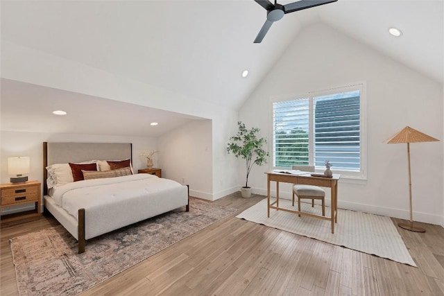 bedroom with light wood-type flooring, high vaulted ceiling, a ceiling fan, recessed lighting, and baseboards