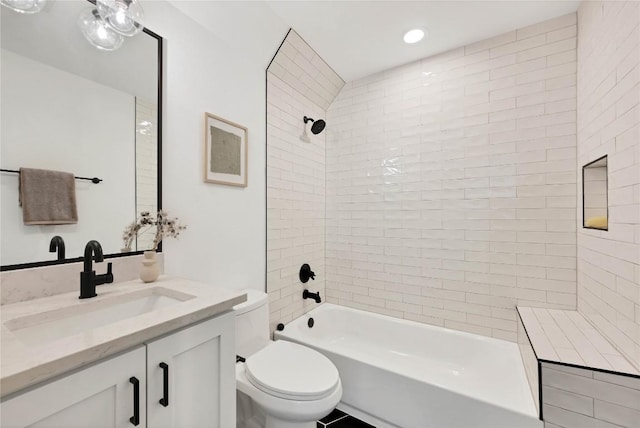 bathroom featuring vanity, toilet, and shower / bath combination