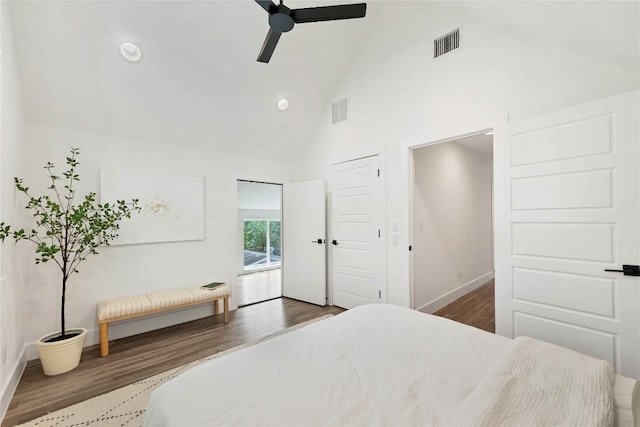3100 S 5th St Unit 1, Austin, TX 78704 - bedroom with wood finished floors, high vaulted ceiling, baseboards, ceiling fan, and recessed lighting