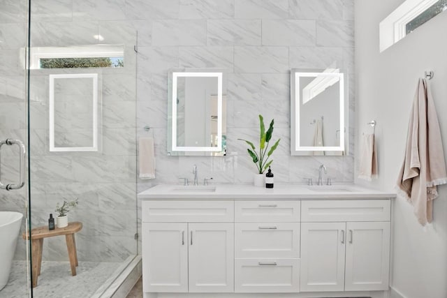 3100 S 5th St Unit 1, Austin, TX 78704 - full bath with double vanity, healthy amount of natural light, a walk in shower, and a freestanding bath