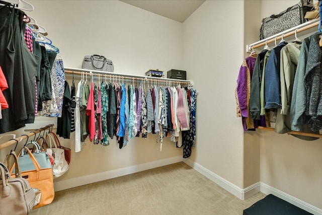 walk in closet featuring carpet