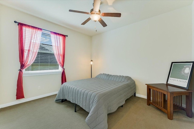 bedroom featuring a ceiling fan, baseboards, and carpet floors