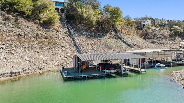 view of dock with a water view and boat lift