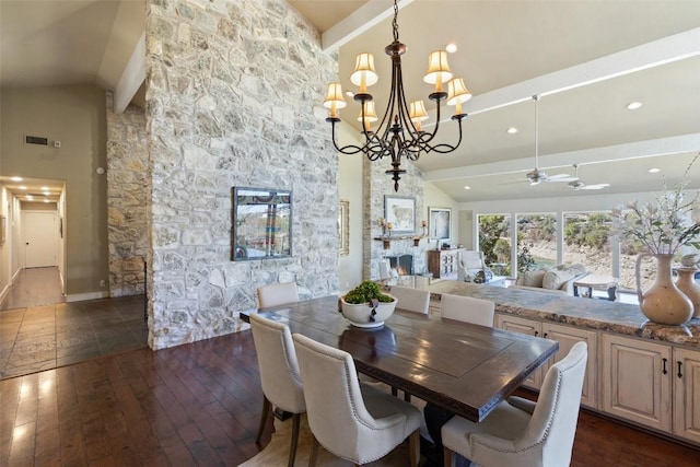 dining space with recessed lighting, ceiling fan with notable chandelier, a fireplace, dark wood-style floors, and high vaulted ceiling