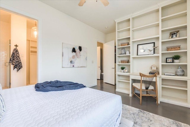 bedroom featuring baseboards, a ceiling fan, dark wood-style floors, and built in desk