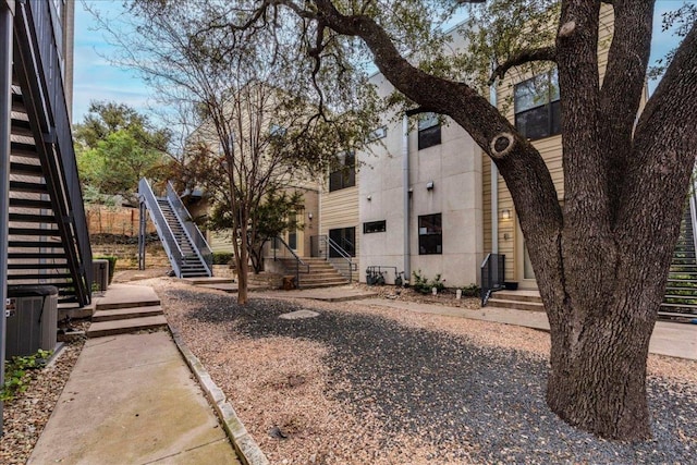 exterior space featuring entry steps and stairway