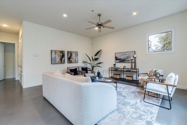 living area with a ceiling fan, recessed lighting, baseboards, and finished concrete floors