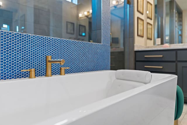 714 Crystal Creek Dr, Austin, TX 78746 - bathroom featuring a freestanding bath, vanity, and tiled shower