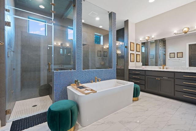714 Crystal Creek Dr, Austin, TX 78746 - full bathroom featuring a freestanding tub, vanity, a shower stall, marble finish floors, and tile walls