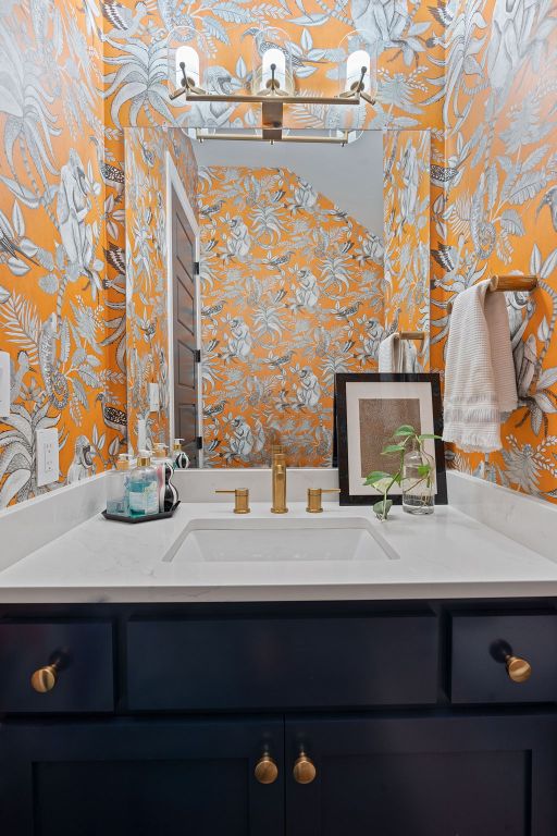 714 Crystal Creek Dr, Austin, TX 78746 - bathroom featuring wallpapered walls and vanity