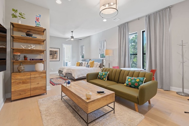 bedroom with recessed lighting, visible vents, baseboards, and light wood finished floors