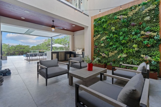 view of patio featuring an outdoor living space, grilling area, exterior kitchen, and outdoor dining space