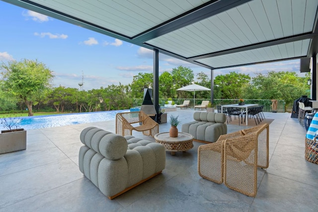 view of patio featuring an outdoor pool and outdoor dining area