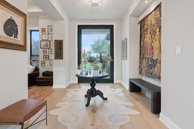 714 Crystal Creek Dr, Austin, TX 78746 - entryway with light wood-style floors and baseboards