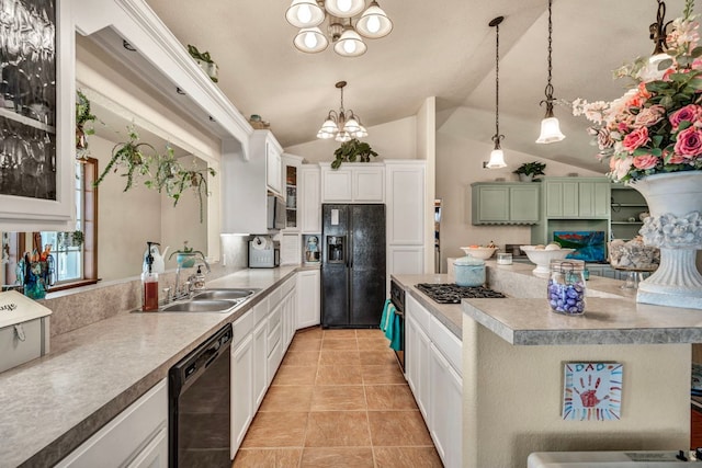 kitchen featuring a notable chandelier, black appliances, a sink, a center island, and glass insert cabinets