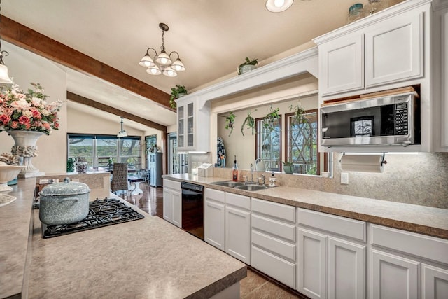 kitchen with white cabinetry, black appliances, and a sink