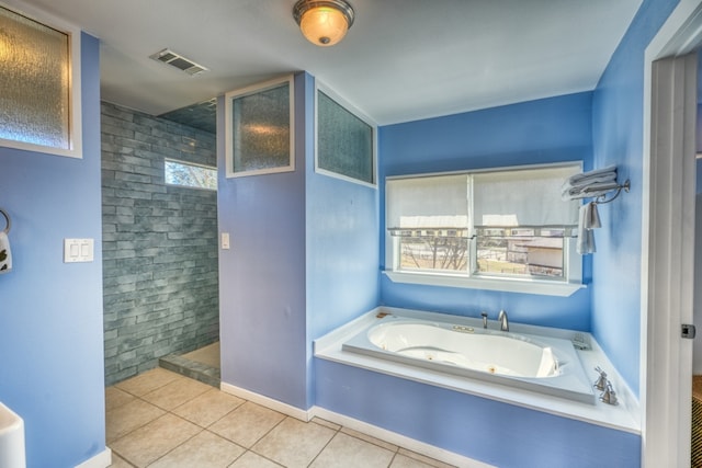331 Grandview Dr, Horseshoe Bay, TX 78657 - bathroom featuring tile patterned flooring, a tub with jets, and a walk in shower