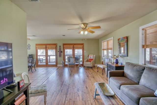 331 Grandview Dr, Horseshoe Bay, TX 78657 - living area featuring healthy amount of natural light, ceiling fan, light wood-type flooring, and baseboards