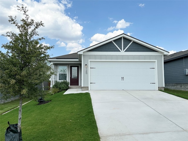 single story home featuring board and batten siding, an attached garage, driveway, and a front yard