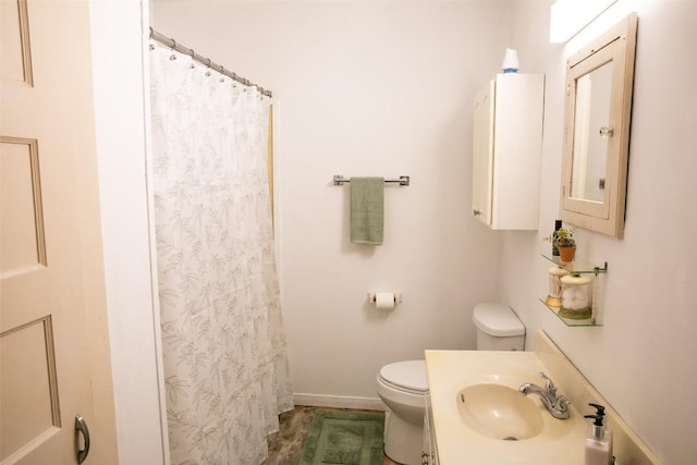 bathroom with toilet, electric panel, a shower with shower curtain, baseboards, and vanity